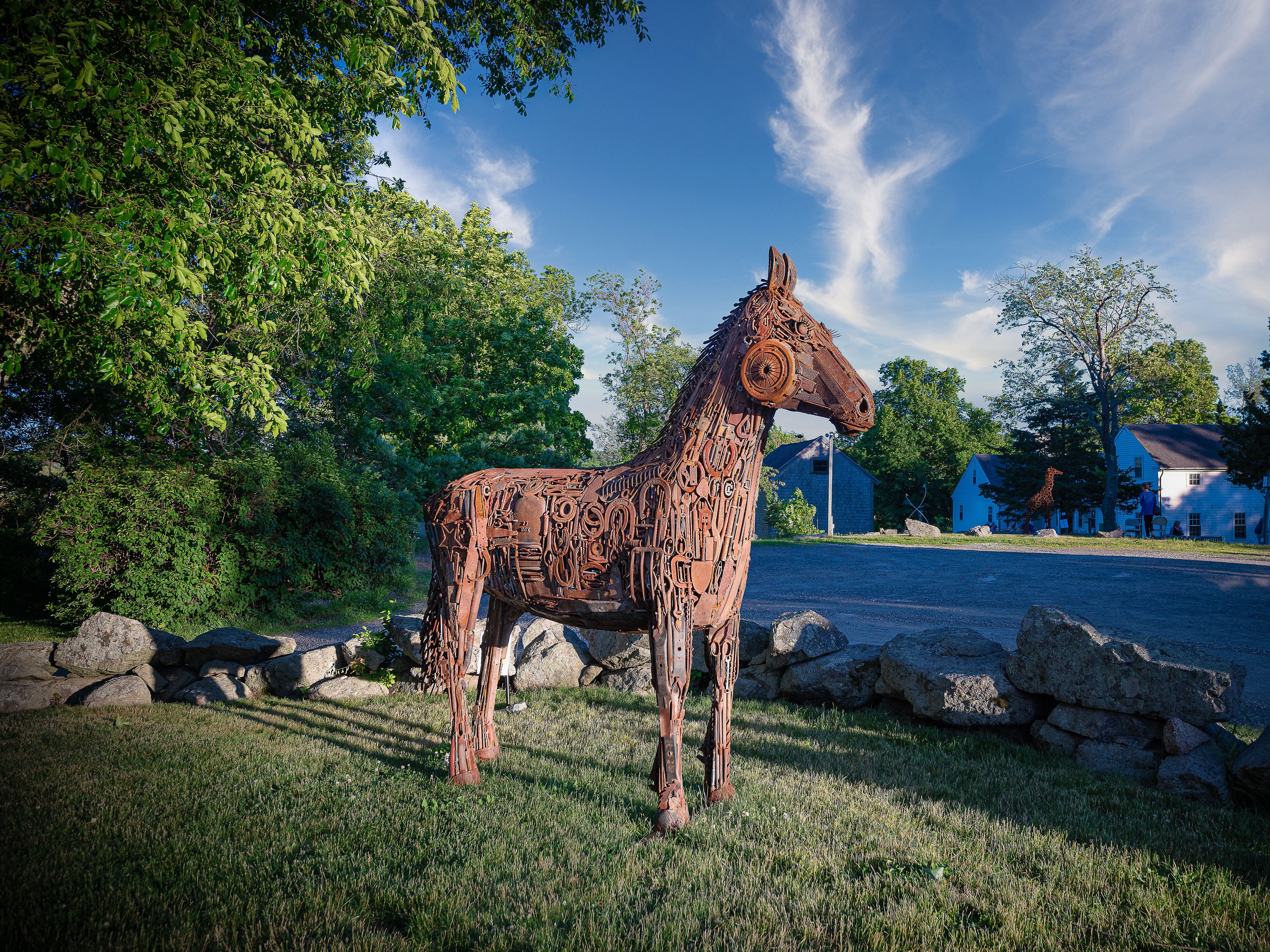 Art in the Barn Landscape Sculpture of a horse using recycled metal materials